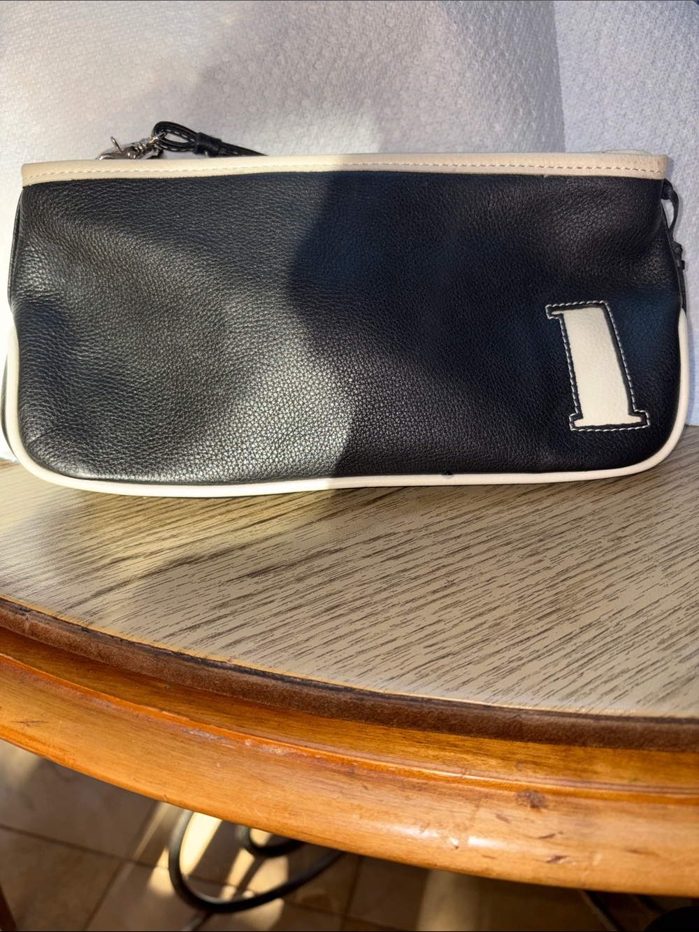 Rolfs Black and Cream Leather Wristlet Clutch